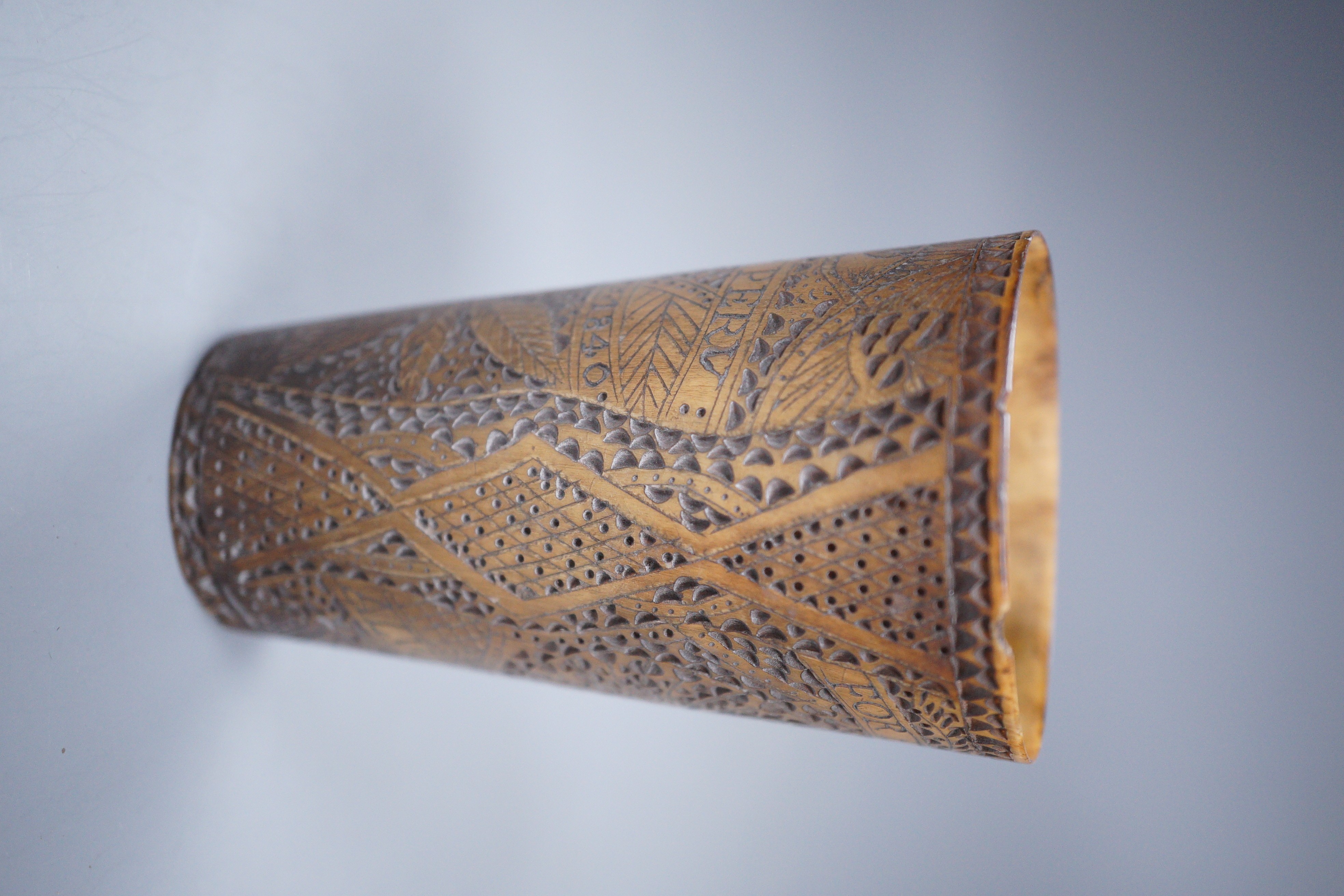 A 19th century carved horn beaker, titled ‘Ship Peru’, dated ‘Feb 12th 1840’, initialled ‘W.M’, the reverse carved ‘FOREVER TRUE ALWAYS YOURS’, height 10cm